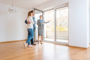 young couple getting tour through apartment they consider renting